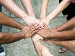 Hands coming together from many different ethnicities or skin colours